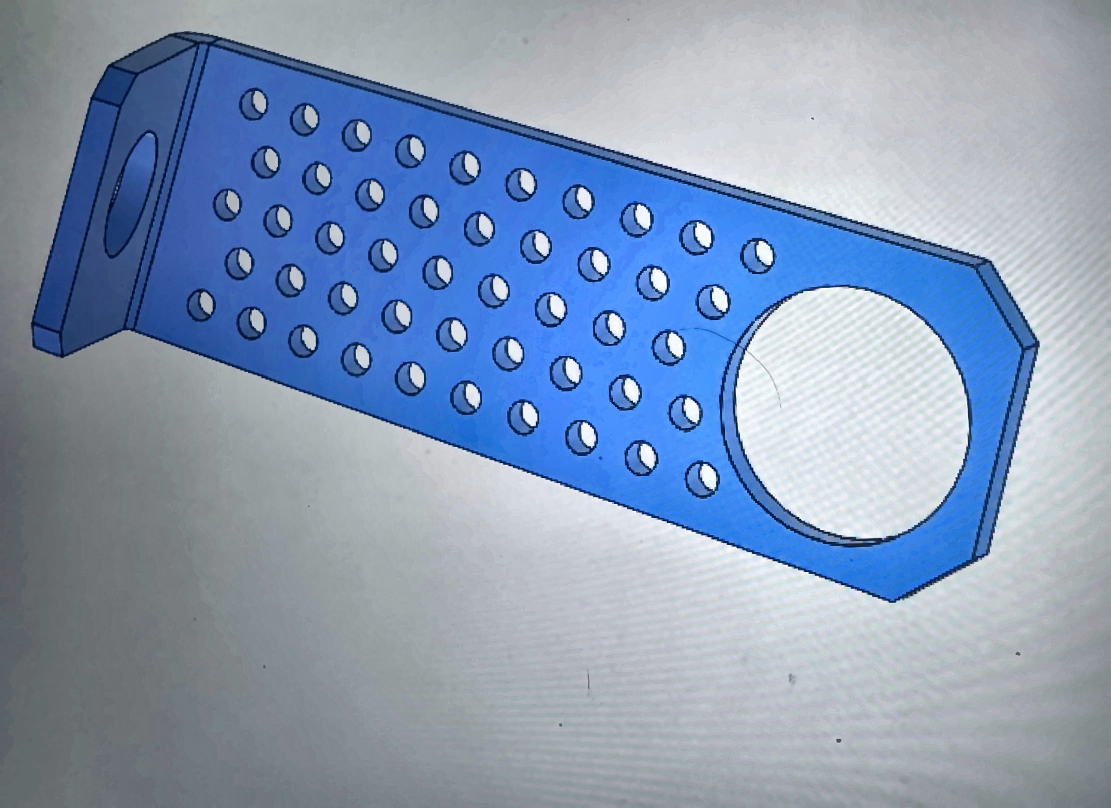 SolidWorks model of a precision-machined aluminum mounting bracket with a hex-profile end and a pattern of lightening holes